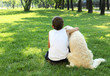 Photo: Tennager boy in the park with a dog Tennager boy in the park with a dog