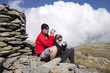 Hiker couple taking pictures up in the mountains Hiker couple taking pictures up in the mountains