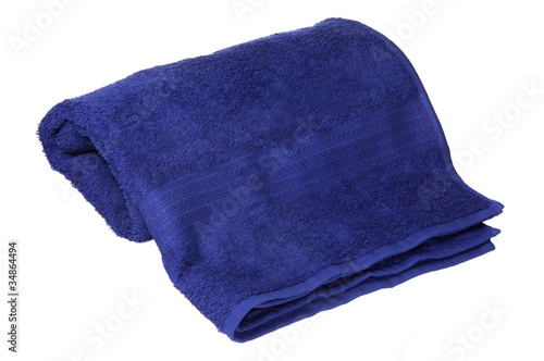 Photo: blue towel rolled up on a white background blue towel rolled up on a white background