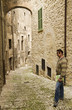 Adult Tourist Visiting Towns in Tuscany and Umbria, Italy