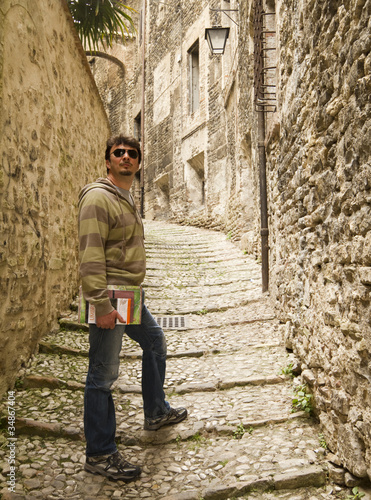 Photo: Adult Tourist Visiting Towns in Tuscany and Umbria, Italy Adult Tourist Visiting Towns in Tuscany and Umbria, Italy