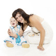 Portrait of happy mother sitting with her smiling baby