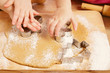 little girls cutting gingerbread christmas cookies, hands only little girls cutting gingerbread christmas cookies, hands only