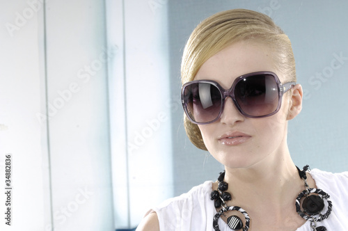 Photo: fashion model in modern sunglasses fashion model in modern sunglasses
