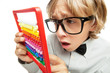 Photo: Young boy with abacus toy calculator Young boy with abacus toy calculator