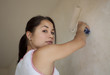 girl painting apartment