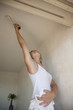 girl painting apartment