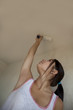 girl painting apartment