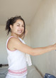 girl painting apartment