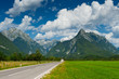 Idyllic mountain valley with road and meadow. Slovenia Idyllic mountain valley with road and meadow. Slovenia