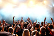 concert crowd in front of bright stage lights
