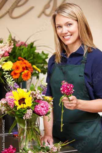 Photo: Woman working in florist Woman working in florist