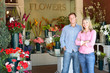 Couple standing outside florist