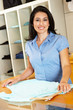 Hispanic woman working in fashion store