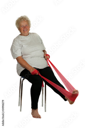 Photo: Senior woman with a fitness band on white background Senior woman with a fitness band on white background