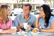 Friends chatting outside café