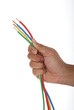Man's hand holding a pack of wire