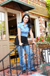 Woman standing outside bakery/café