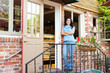 Woman standing outside bakery/café