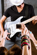 Guitarist playing for is fans