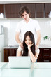 a young couple relaxing in the kitchen