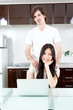 a young couple relaxing in the kitchen