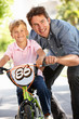 Father with boy on bike