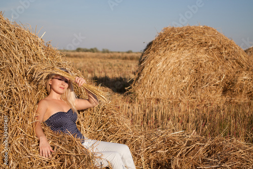 Photo: The beautiful girl in the field with wheat The beautiful girl in the field with wheat
