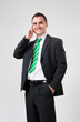 Photo: confident businessman talking on his mobile phone confident businessman talking on his mobile phone