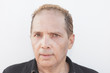 Headshot of a balding man