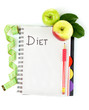 Planning of a diet. Notebook, pencil and fresh apples