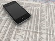 Wirtschaftsblatt mit Telefon