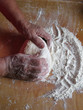 Foto: baker's hands knead dough baker's hands knead dough