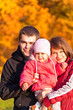 Happy family enjoying a autumn day at nature