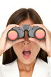 Binoculars woman looking surprised