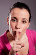 Young woman asking for silence. Studio shot Young woman asking for silence. Studio shot