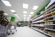 Shelves with variety of accessories for home flowers inside shop