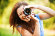young smiling girl making photo
