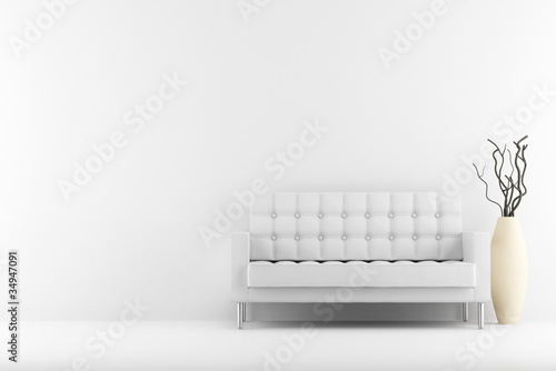 Photo: leather couch and vase with dry wood in front of white wall leather couch and vase with dry wood in front of white wall