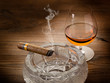 cuban cigar over ash tray and cognac cuban cigar over ash tray and cognac