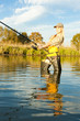 woman fishing in pond