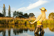 woman fishing in pond