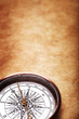 Old compass on vintage paper background Old compass on vintage paper background