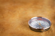 Vintage compass on old paper background Vintage compass on old paper background