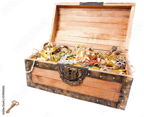 Photo: treasure chest with key isolated on white treasure chest with key isolated on white