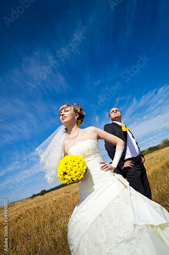 Photo: Beautiful couple on the yellow field Beautiful couple on the yellow field