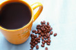 Photo: cup of coffee and coffee beans cup of coffee and coffee beans