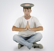 DJ sitting on the floor with vinyl on his head