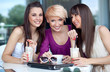 Photo: Three young women having coffee break Three young women having coffee break
