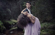 Elegant man carrying woman